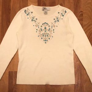 white sweater with turquoise beading